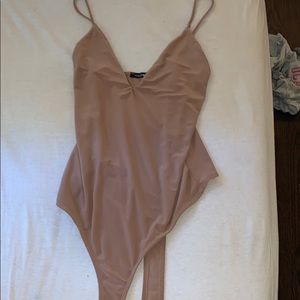 Super cute tan v cut body suit!